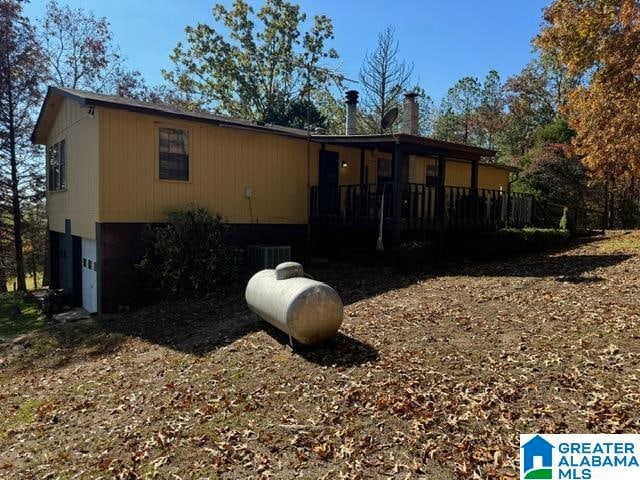 exterior space featuring a garage and a deck