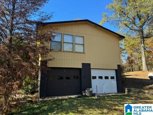 view of property exterior featuring a garage