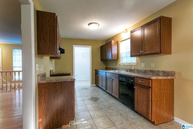 kitchen featuring sink, a textured ceiling, black dishwasher, range hood, and light hardwood / wood-style floors