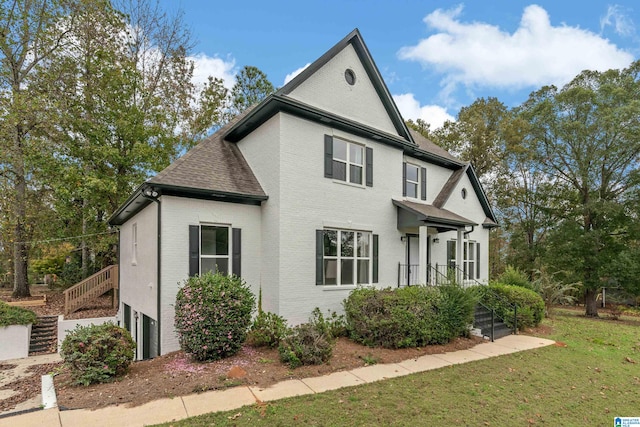 view of side of home featuring a yard