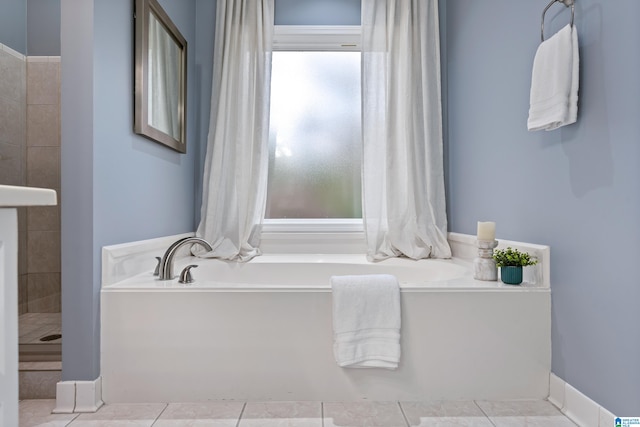 bathroom featuring tile patterned floors and a bathing tub