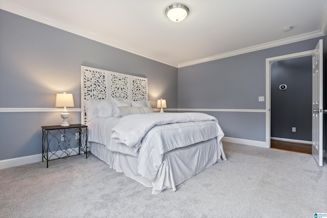 carpeted bedroom featuring ornamental molding