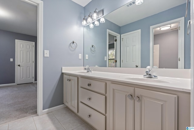 bathroom featuring tile patterned flooring and vanity