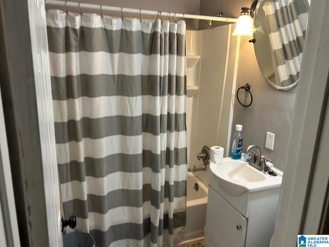 bathroom with shower / bath combo and vanity