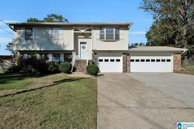 bi-level home with a front yard and a garage