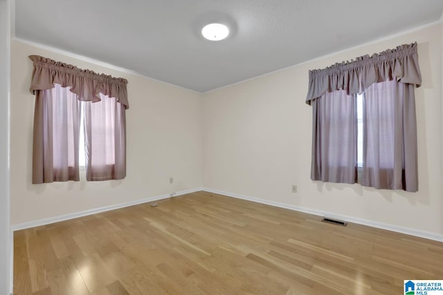 empty room featuring hardwood / wood-style floors