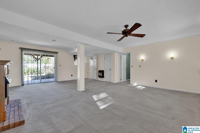 unfurnished living room with light carpet and ceiling fan