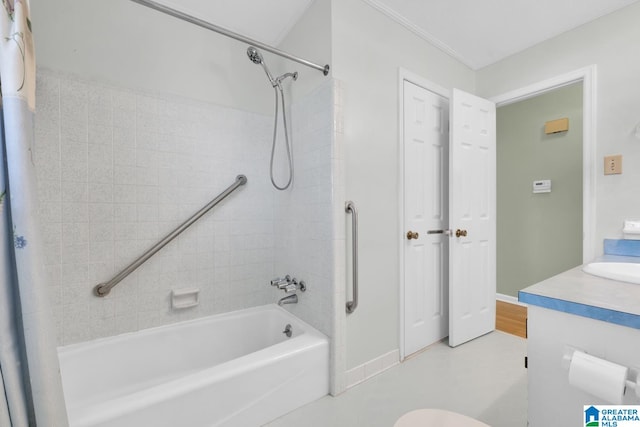 full bathroom featuring vanity, toilet, crown molding, and tiled shower / bath