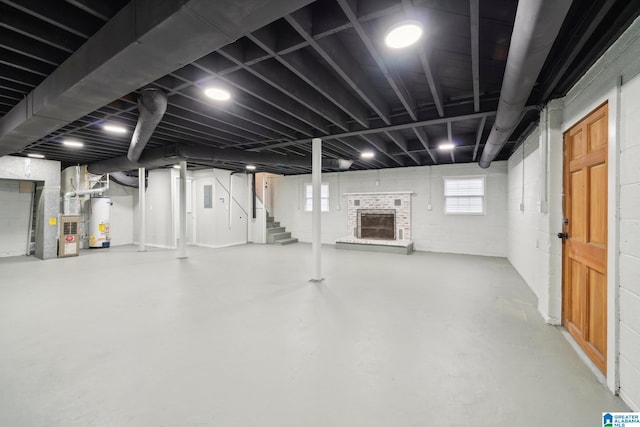 basement featuring gas water heater and heating unit