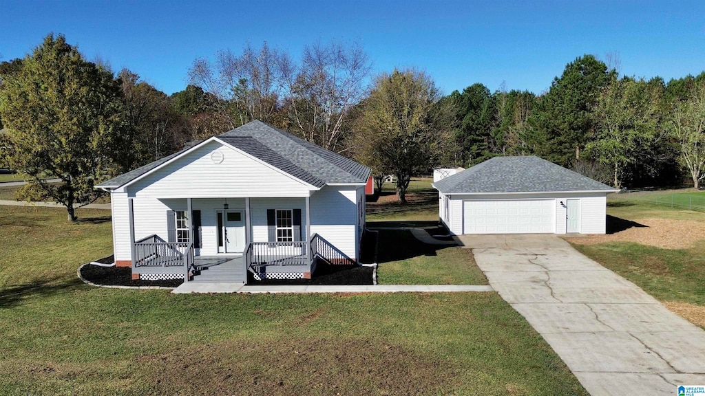 view of front facade with a front yard, a garage, an outdoor structure, and covered porch