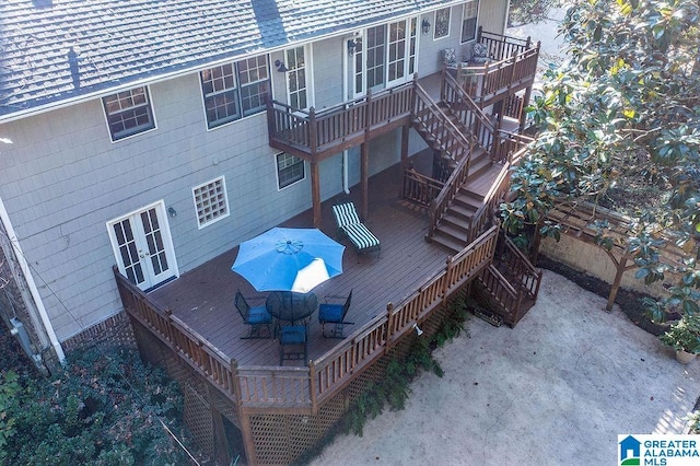 exterior space with french doors and a deck