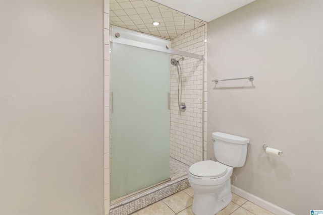 bathroom with tile patterned flooring, an enclosed shower, and toilet