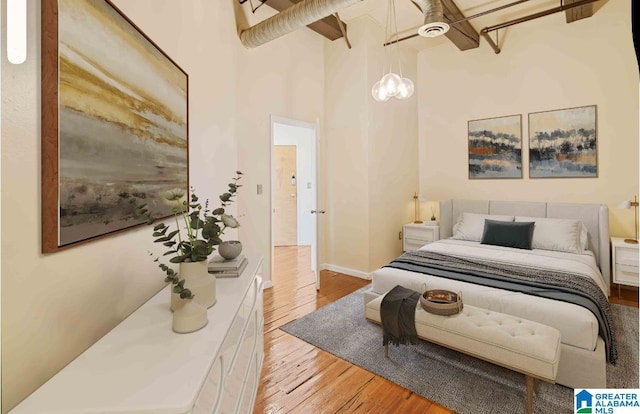 2301 1st Ave N Unit 203, Birmingham, AL 35203 - bedroom with wood finished floors and a towering ceiling