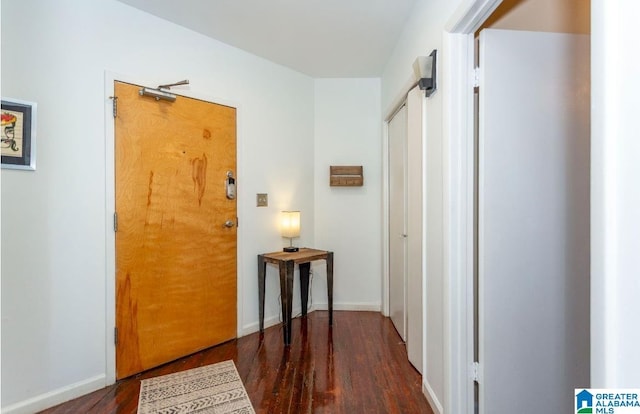 hallway with dark hardwood / wood-style floors