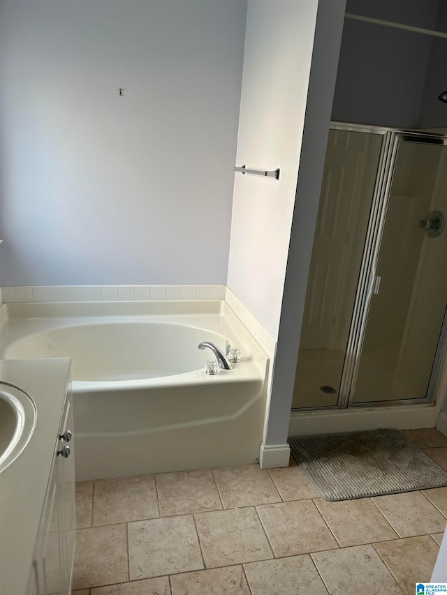 bathroom featuring plus walk in shower and vanity