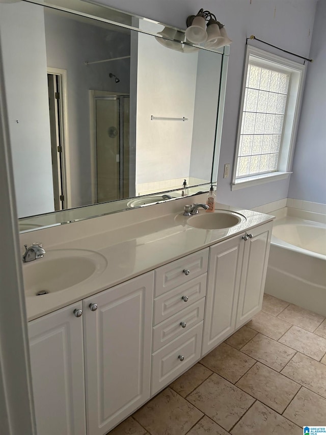 bathroom featuring vanity and separate shower and tub