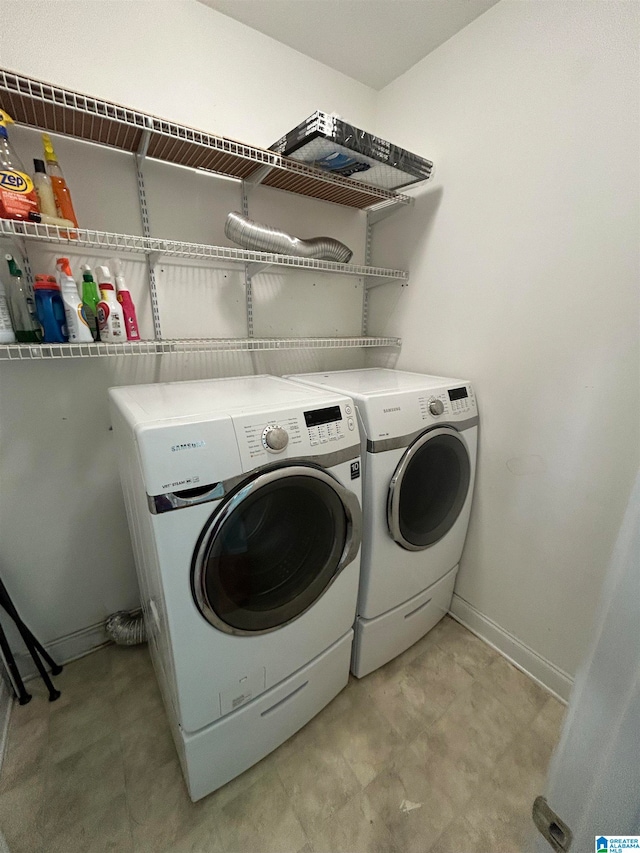 laundry room with independent washer and dryer