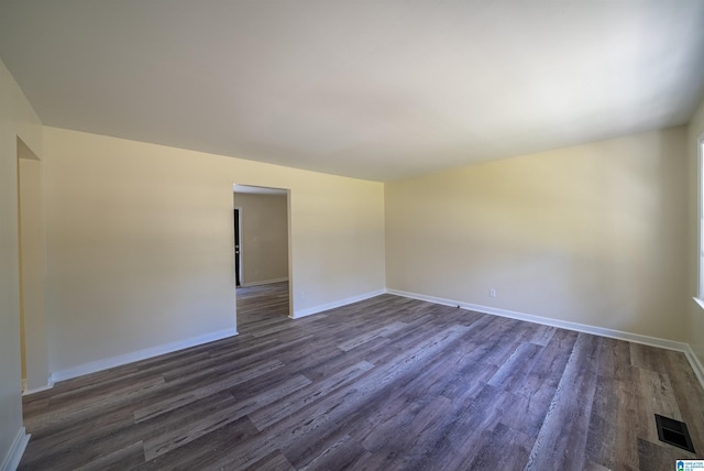 unfurnished room featuring dark hardwood / wood-style floors