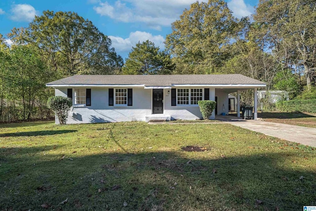 ranch-style home with a front yard and a carport