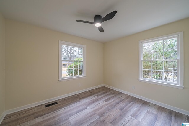 spare room featuring ceiling fan and light wood-type flooring