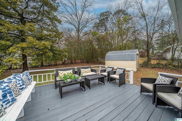 deck with an outdoor hangout area and a shed