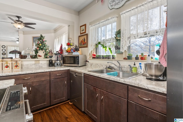 923 Cogswell Ave, Pell City, AL 35125 - kitchen featuring stainless steel appliances, a sink, light countertops, a ceiling fan, and dark brown cabinetry