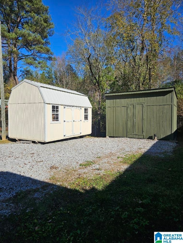 view of outdoor structure featuring a lawn