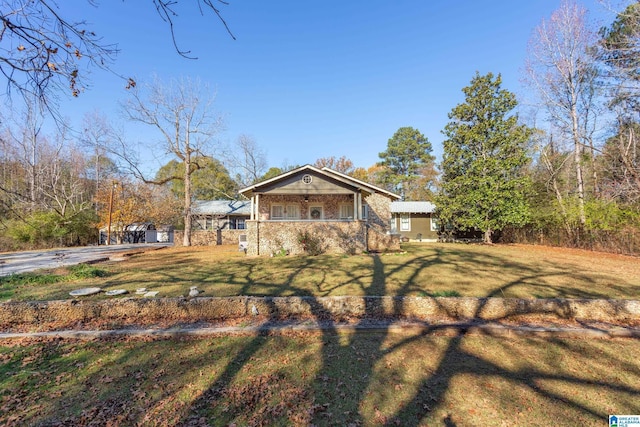 923 Cogswell Ave, Pell City, AL 35125 - view of side of home featuring brick siding and covered porch