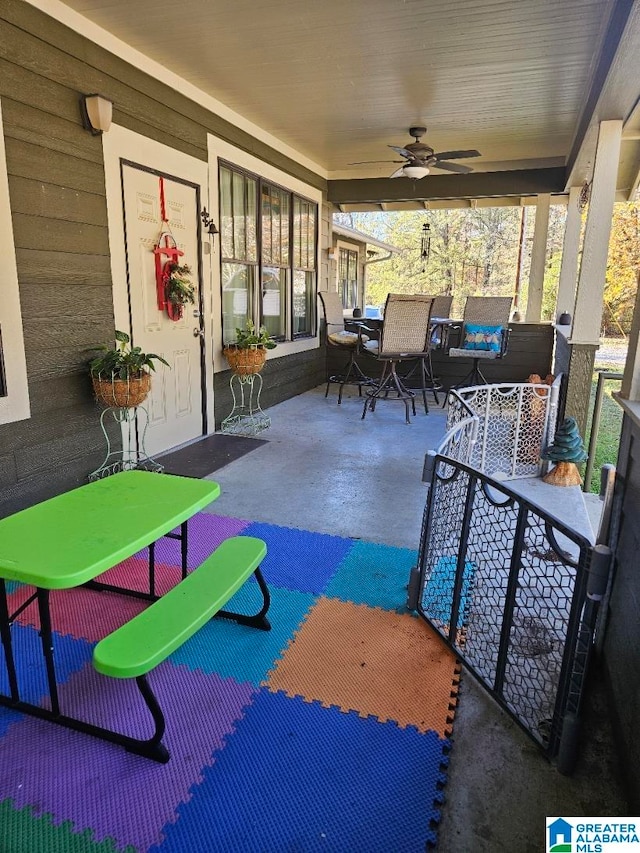 view of patio featuring ceiling fan