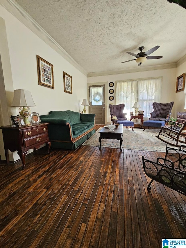 living room with hardwood / wood-style floors, ceiling fan, ornamental molding, and a textured ceiling