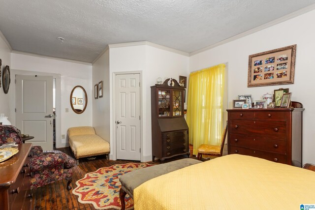 923 Cogswell Ave, Pell City, AL 35125 - bedroom with wood finished floors, a textured ceiling, and ornamental molding