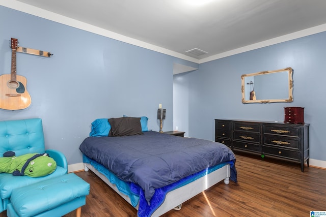 923 Cogswell Ave, Pell City, AL 35125 - bedroom featuring wood finished floors, baseboards, and crown molding