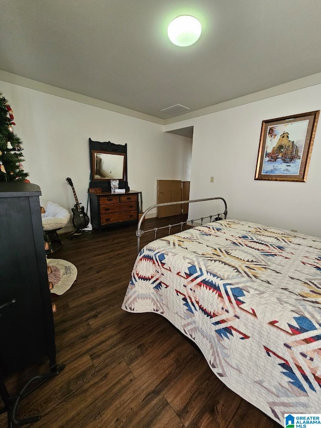 bedroom featuring dark hardwood / wood-style flooring