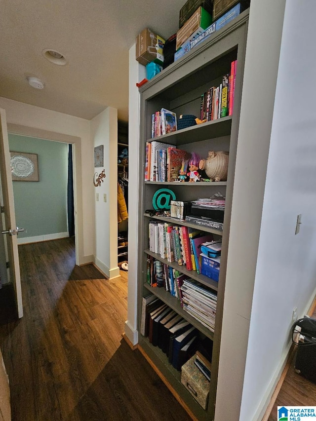 hall with dark hardwood / wood-style floors