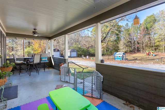 923 Cogswell Ave, Pell City, AL 35125 - view of patio featuring outdoor dining area, a ceiling fan, and view of scattered trees