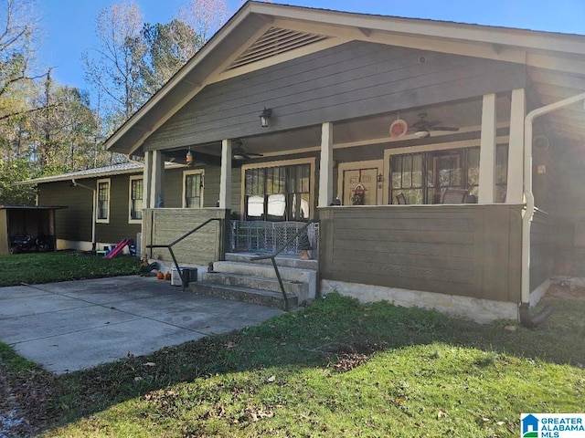 exterior space featuring a front lawn and a porch