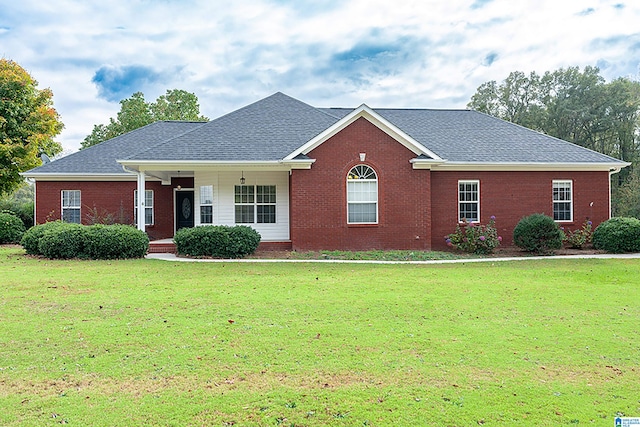 ranch-style home with a front lawn