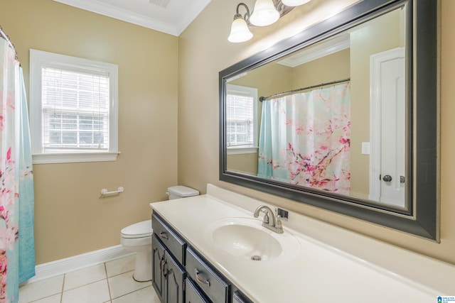 bathroom with tile patterned floors, a wealth of natural light, crown molding, and vanity