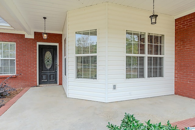 doorway to property featuring covered porch