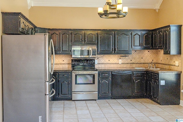 kitchen with decorative backsplash, appliances with stainless steel finishes, crown molding, sink, and light tile patterned flooring