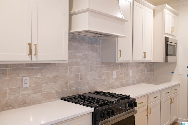 186 Barimore Blvd, Helena, AL 35080 - kitchen featuring black gas range, stainless steel microwave, white cabinets, and light countertops