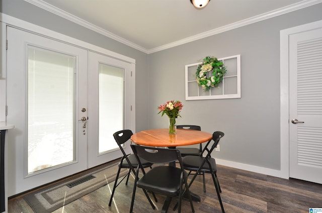 dining area with french doors, dark hardwood / wood-style flooring, and crown molding