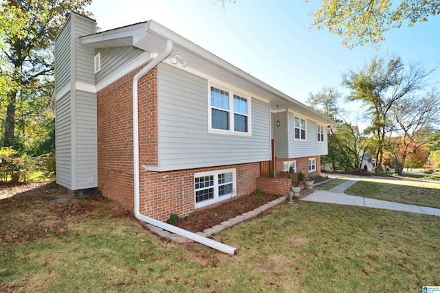 bi-level home with a front lawn