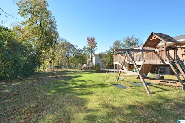 view of yard featuring cooling unit and a deck