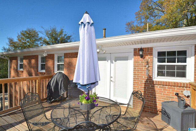 wooden deck featuring area for grilling