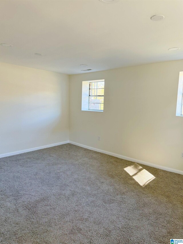 unfurnished room with carpet flooring