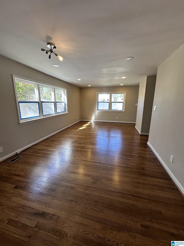101 S 18th Ct, Birmingham, AL 35205 - empty room with healthy amount of natural light, dark wood finished floors, baseboards, and recessed lighting