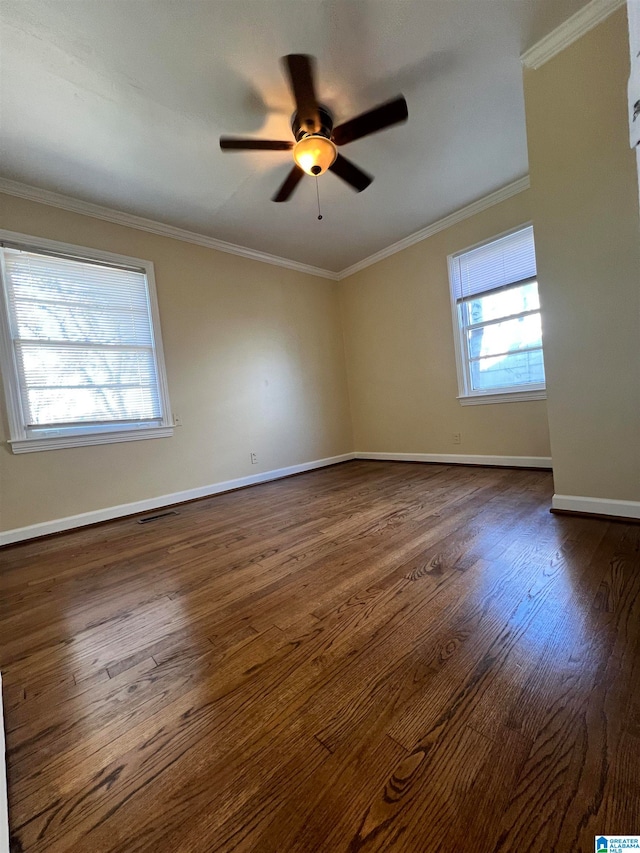 unfurnished room featuring dark hardwood / wood-style floors, ceiling fan, and ornamental molding