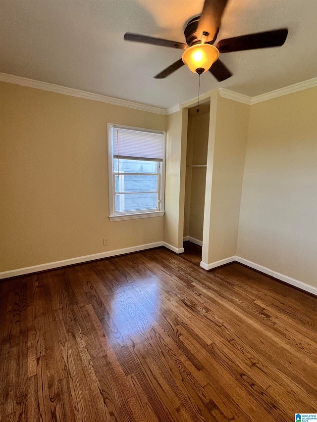 unfurnished bedroom featuring ceiling fan, hardwood / wood-style floors, and crown molding