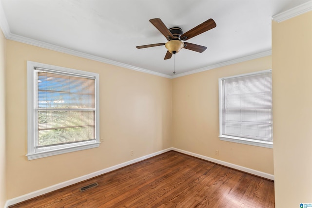 unfurnished room with crown molding, ceiling fan, and wood-type flooring